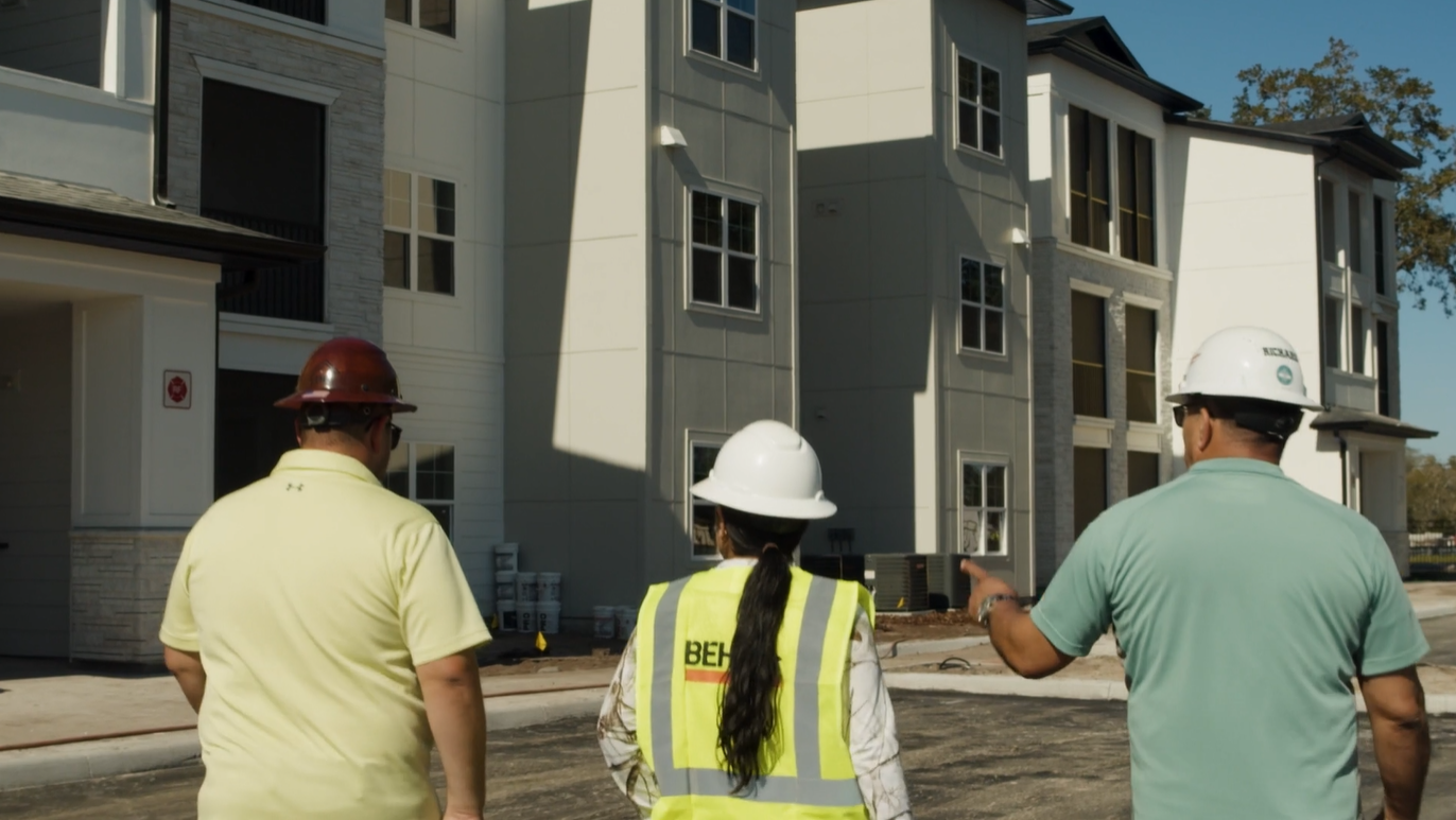 Team inspecting multi-family building