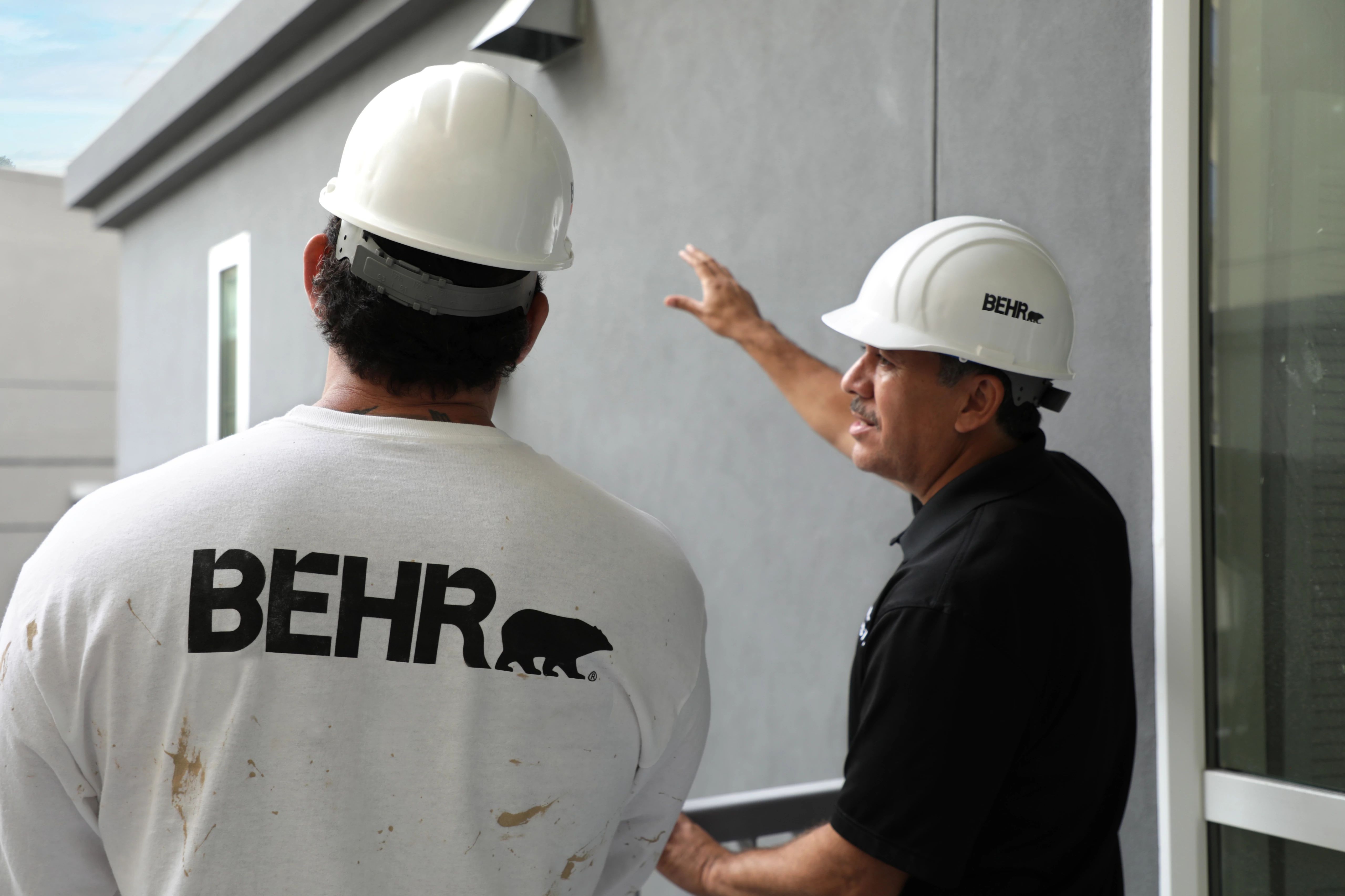 Pro painter and client talking on job site