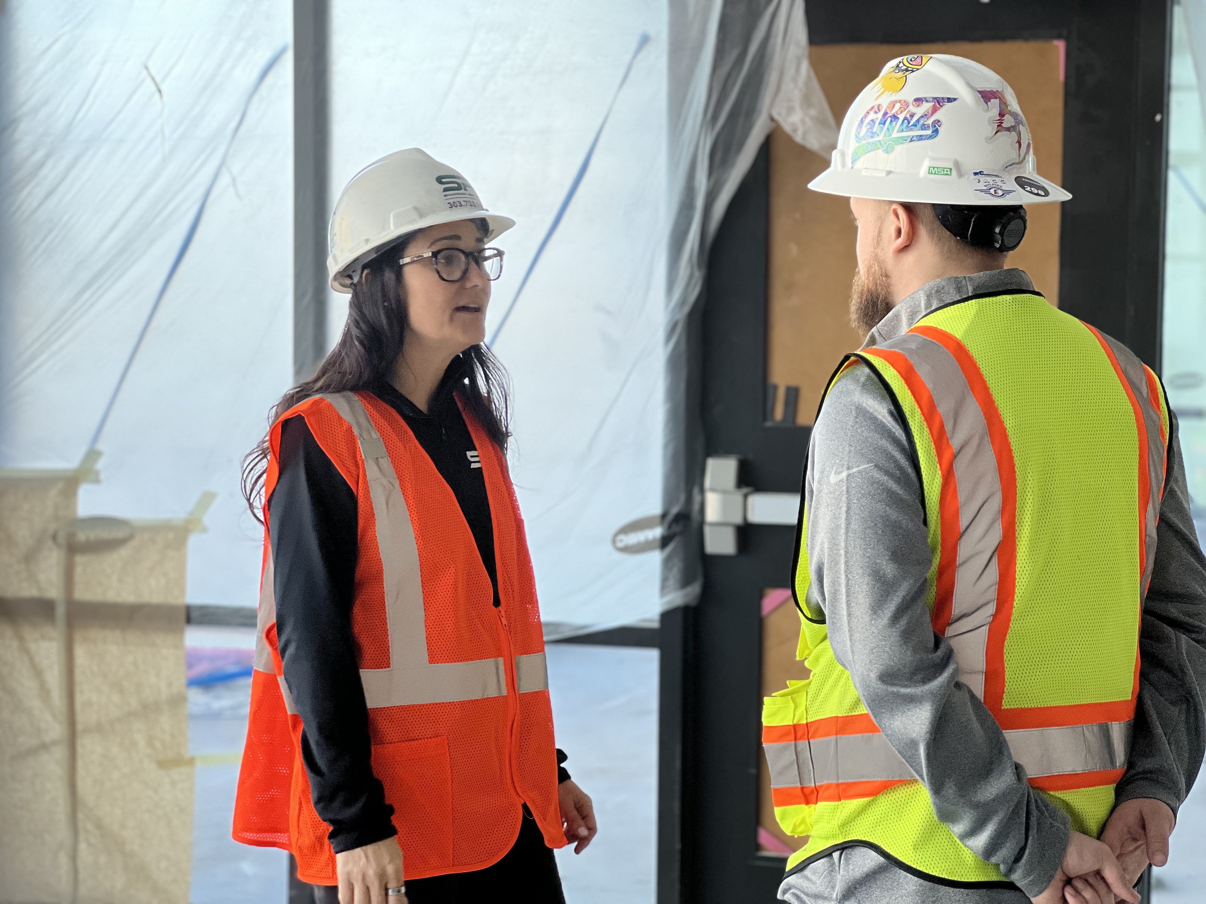 Gina Koert of Shamrock Painting speaking to employee