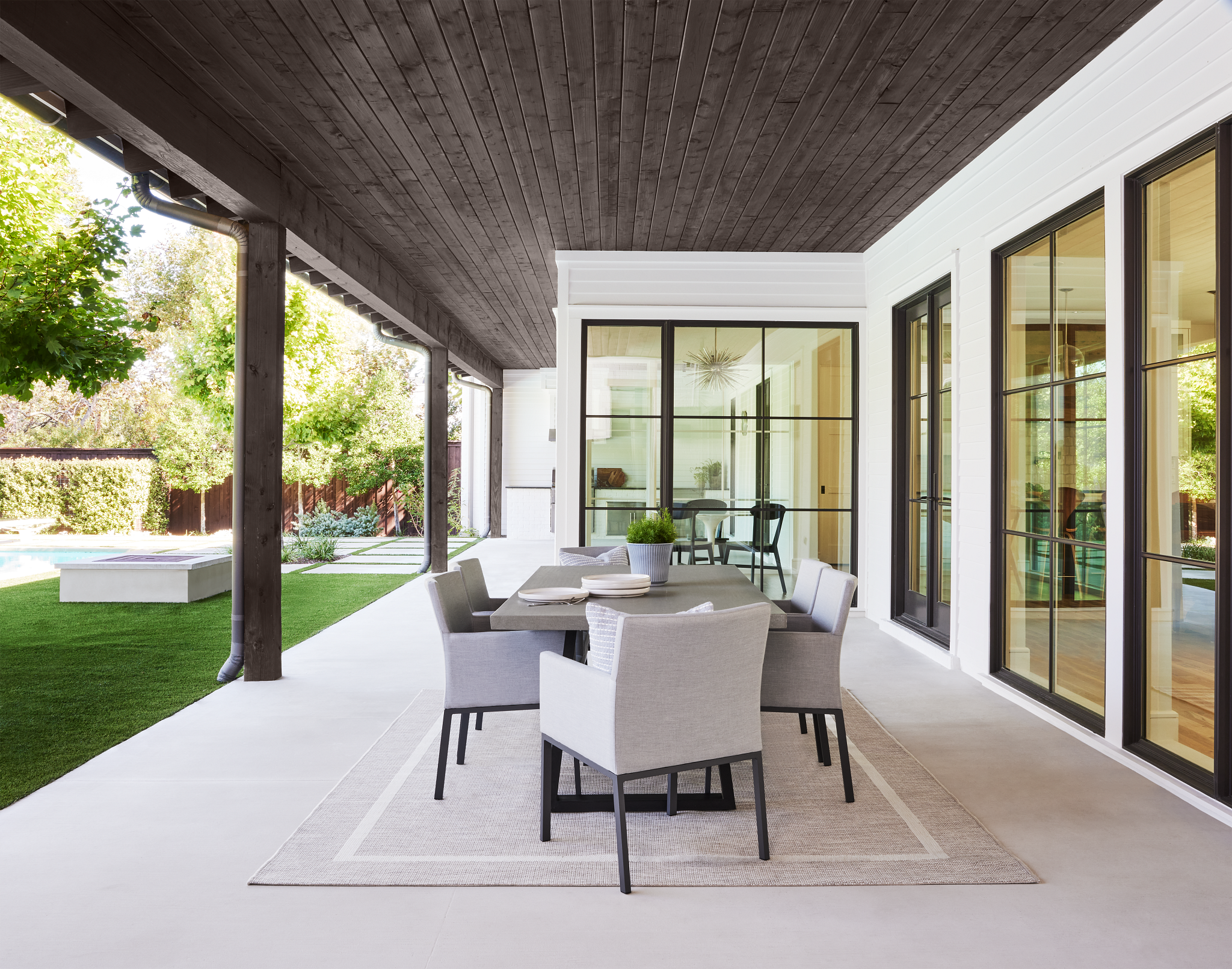 Outdoor living area featuring ceiling stain with Cordovan Brown color