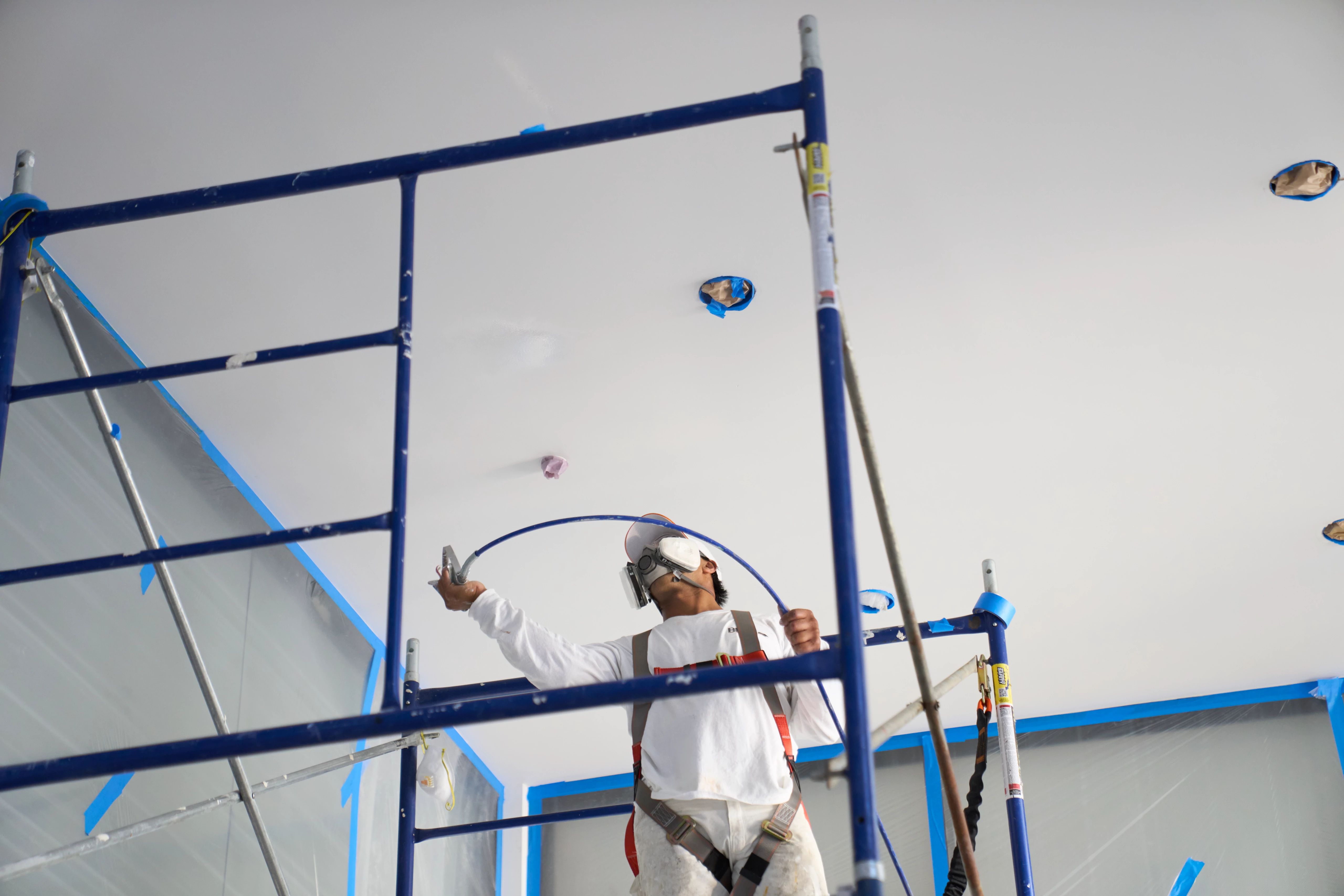 Pro painter painting a ceiling