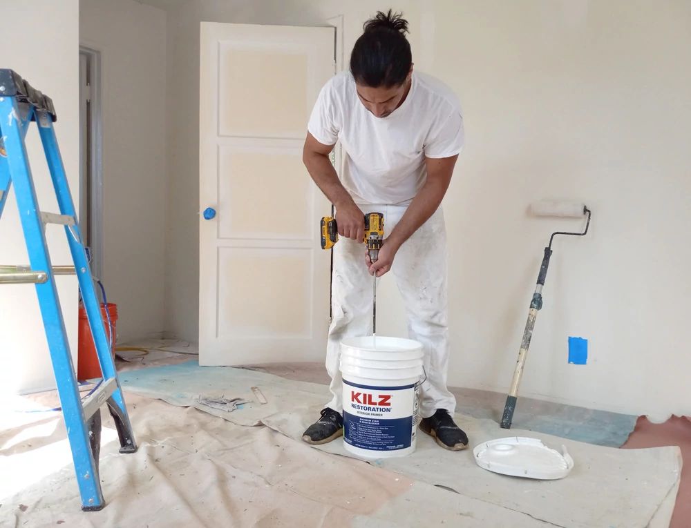 Pro Painter Using KILZ Restoration Primer